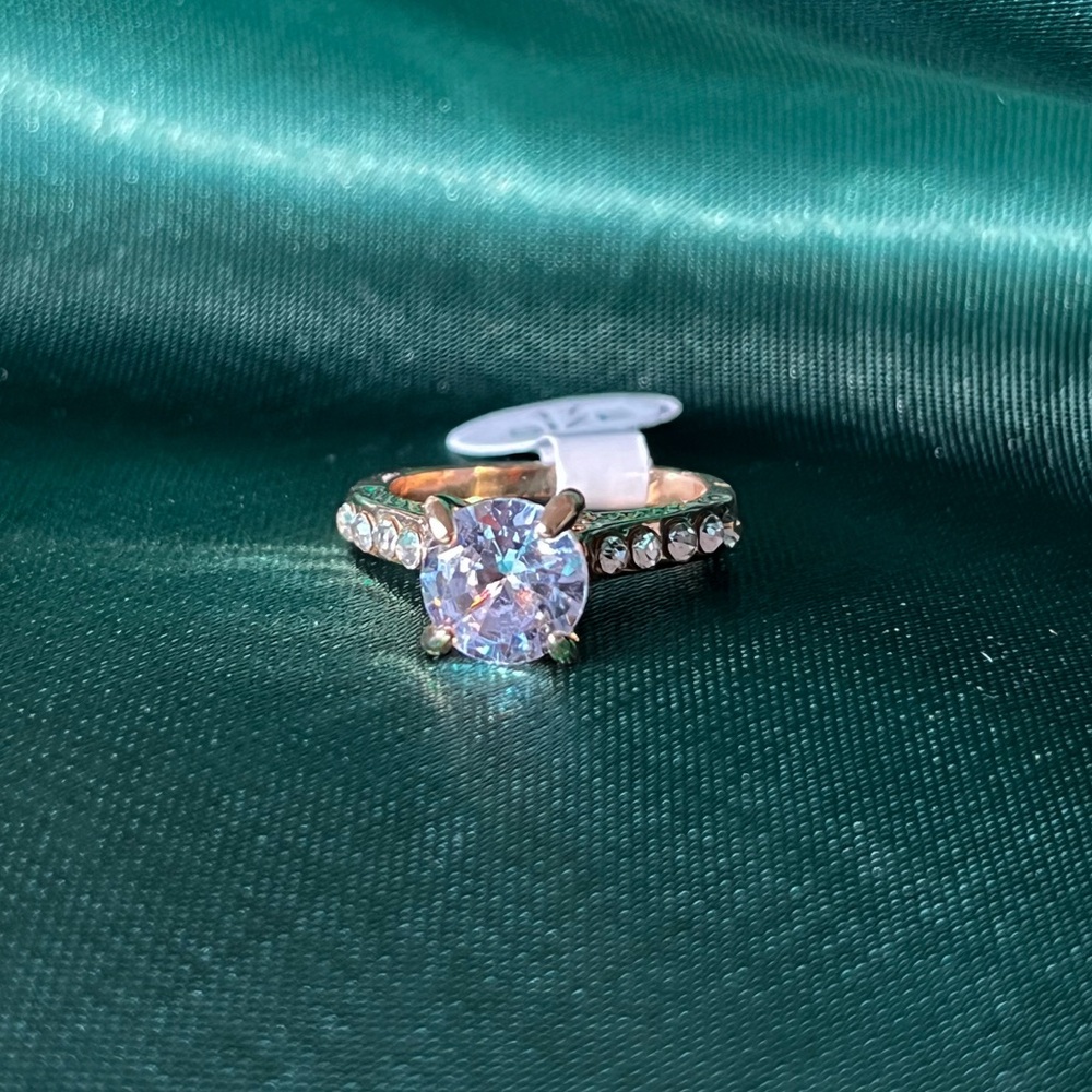 Gold Alloy Ring With Clear Gems